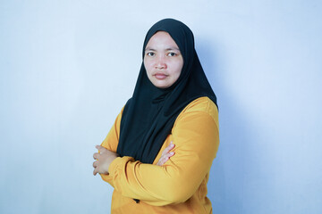 portrait of Asian Muslim woman posing in front of the camera confidently