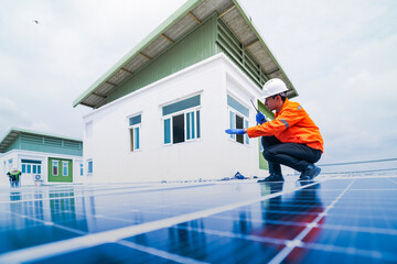 engineer man inspects construction of solar cell panel or photovoltaic cell by electronic device....