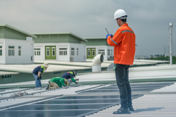 engineer man inspects construction of solar cell panel or photovoltaic cell by electronic device....