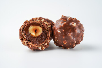 chocolate and hazelnut confectionery balls. chocolate sweet made. Chocolate candies in a gold wrapper