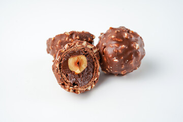 chocolate and hazelnut confectionery balls. chocolate sweet made. Chocolate candies in a gold wrapper