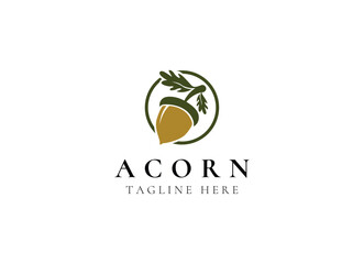 Oak leaf acorn logo simple. Simple Acorn or Oaknut with Oak Leaves Branch silhouette classic logo design © AlvinStd.