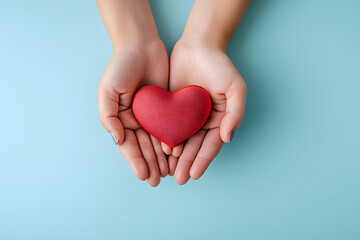 Obraz premium Family hands holding red heart, heart health insurance, charity volunteer donation, CSR responsibility, world heart day, world health day, family day, adoption foster care home, compliment concept