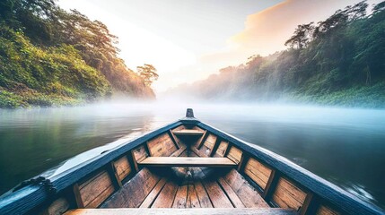 Fototapeta premium Serene boat view on a misty river at dawn.