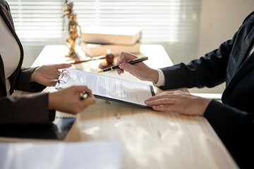 Lawyer explaining contract details before signing in law office