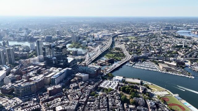 Drone flight above the bridges and roads with cars over Charles river. Boston. Massachusetts, USA.