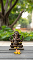 Ganesh statue with lotus flower, serene background