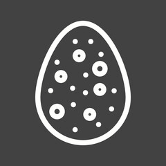 White egg with spots on a black background.