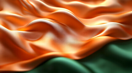 Obraz premium Flowing fabric in orange and green, reminiscent of a flag.