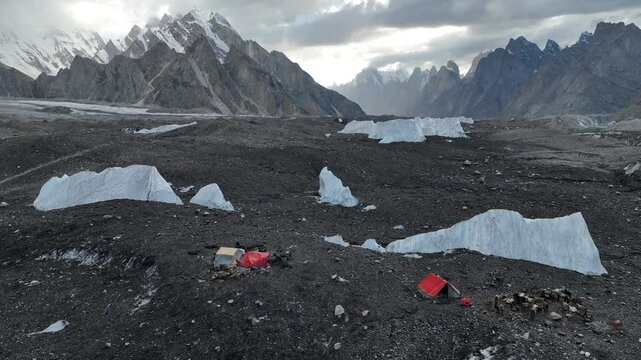 Tents at Goro 2 Campsite surrounded by large chunks of ice along the K2 Base Camp Trek in Pakistan.