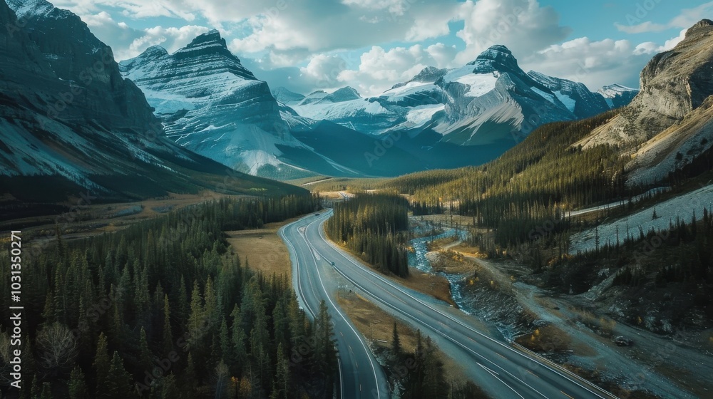 Poster A mountain range is visible in the background of a road. The road is surrounded by trees and is a winding road