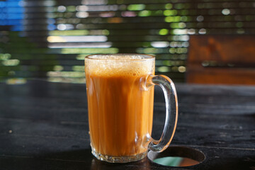 A glass of milk tea, or famously known as Teh Tarik in Malaysia