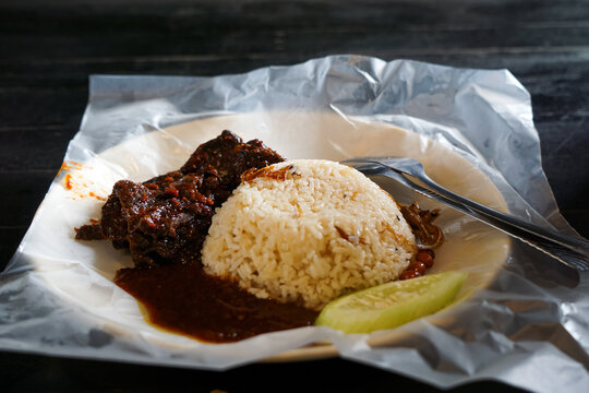 Close up of Nasi lemak, a Malay style complete meal of fragrant rice cooked in coconut milk.