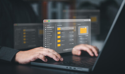 Businessman uses a computer laptop to manage files on document server. DMS, Cloud backup online...