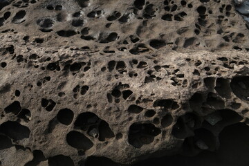 stone-texture-background, texture of porous stones on the beach, nature, natural phenomena, brown-gray stones, stones with wholes