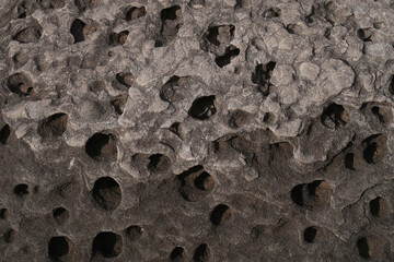 stone-texture-background, texture of porous stones on the beach, nature, natural phenomena, brown-gray stones, stones with wholes