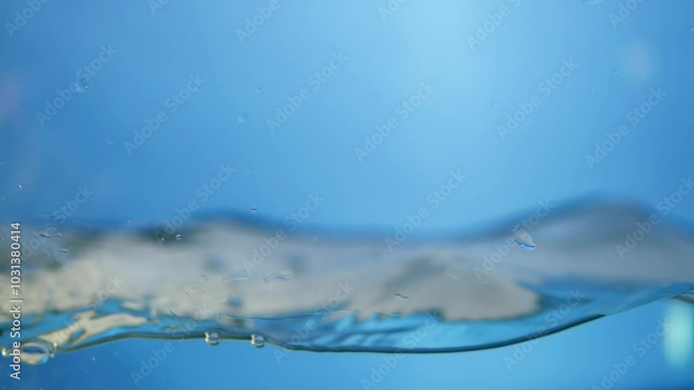 Poster charming close-up image of the water surface in slow motion, emphasizing the essence of clean drinki