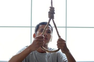Man Hands Trying to Hold Rope With Hangman's Noose Knot For Suicide. 
