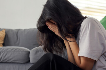 Fototapeta premium Depression Woman Crying While Sitting on The Floor 