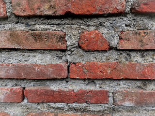 Dark red brick wall pattern texture background.