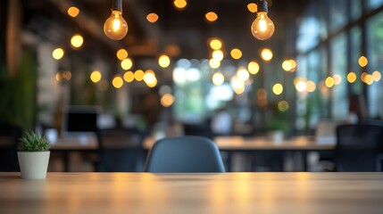 Cozy office space with lights, plants, and wooden table.