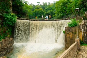 A young family travels in the summer to places of historical architecture