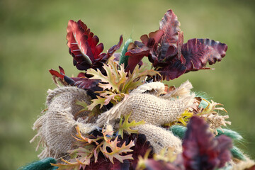 Autumn harvest arrangement with dried flowers and textured fabric