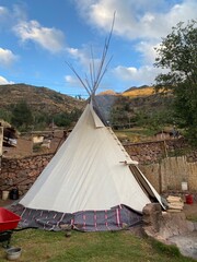 Traditional teepee for a spiritual ceremonies in a morning mountains