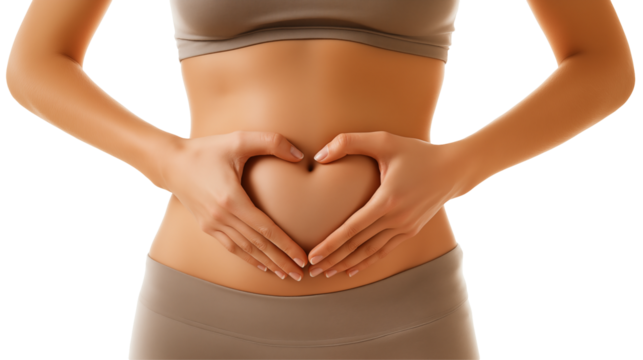 close-up of a young woman's hands forming a heart shape on her stomach promoting self-care and wellness concepts
