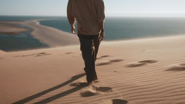 Tourist girl walking and enjoying nature and vacation in slow motion on a beautiful dune sunset near the coast of Sandwich Harbour, Namibia, Africa
