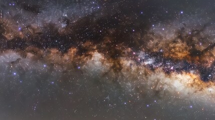 Obraz premium A starry night sky with a large cloud of dust and gas