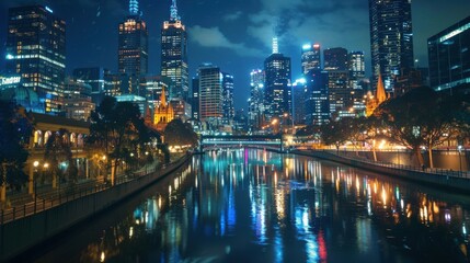 Fototapeta premium A city at night with a river running through it