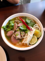 Traditional Vietnamese Soup Pho Bo with Rice Noodles, Beef and Herbs, Asian Cuisine