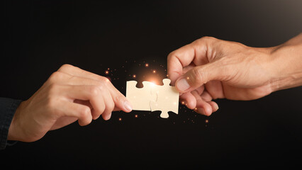Businessman holding a puzzle piece to find a business solution ,Connecting success and problem...