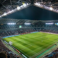 A large stadium with bright lights and green grass