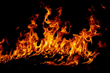 Texture of fire on a black background. Abstract fire flame background, large burning fire.