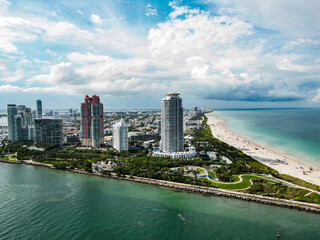 Obraz premium Miami beach, ocean drive summer cityscape. Miami Beach, South Beach, Florida, USA. Coastline, aerial view. Aerial view of high skyscrapers and ocean, Miami Beach, Florida, USA.