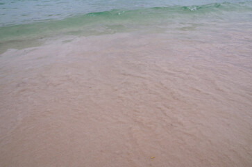 Ocean waves and fine sandy beach