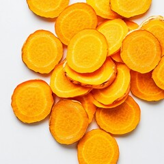 Close-Up of Fresh Turmeric Slices on White Surface with Vibrant Color and Soft Studio Lighting