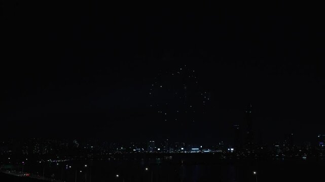 Firework display in Night City Skyline During Seoul International Firework Festival at the Yeouido Han River 2024 - aerial View