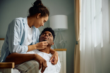 Young multiracial couple in love enjoying in morning together at home.