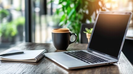 Fototapeta premium Cozy Workspace with Laptop and Coffee on Wooden Table