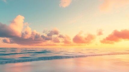 Naklejka premium 2408 44.A stunning sunrise over the sea, with soft clouds in shades of orange, yellow, and pink, lighting up the sky. The horizon glows with the warm light of morning, casting a tranquil and peaceful
