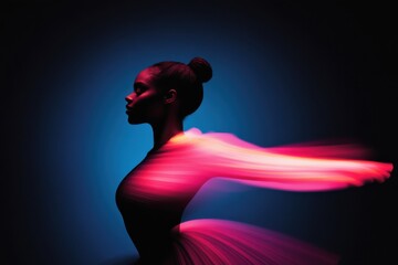 Ballerina posing with light trails flowing around her