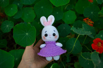 Cute handmade toys cute rabbits crocheted in nature in autumn