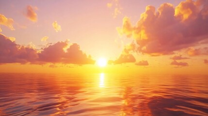 Fototapeta premium 2408 91.A stunning sunset sky with a glowing gradient of orange, yellow, and pink hues, reflecting on the calm surface of the sea. The golden hour illuminates the clouds with warm, radiant light as