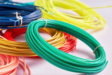 A close-up of colorful 3d pen pla plastic wire rolls. Kids hobby and craft and DIY
