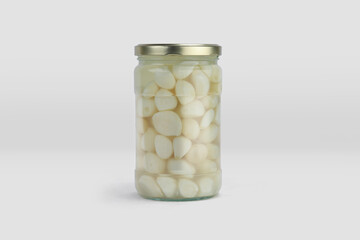 garlic pickle jar mockup, jar of pickled vegetables preserved, canned greens, marinated greens, isolated on white background. jar of pickled garlic