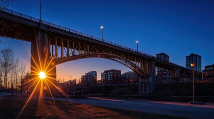 A bridge over a city at sunset with a starburst effect.