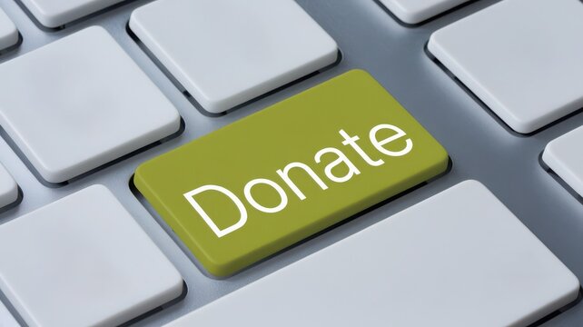 Donate button on a keyboard, promoting charitable giving and social support.
